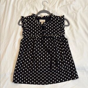 Black Sleeveless Top with White Floral Pattern